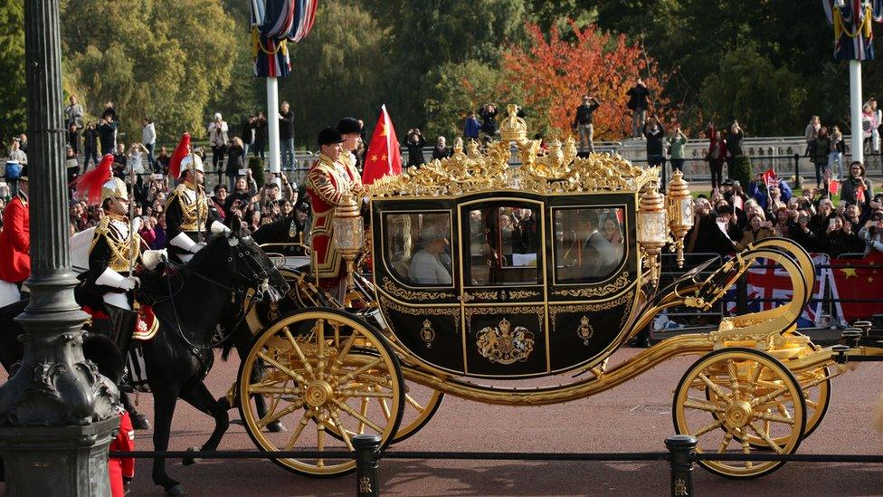 Queen Elizabeth II and President of The People's Republic of China, Xi Jinping, ride in the Diamond Jubilee State Coach along The Mall after the ceremonial welcome on Horse Guards Parade for the Chinese President on the first day of his state visit to the UK on October 20, 2015 in London, England