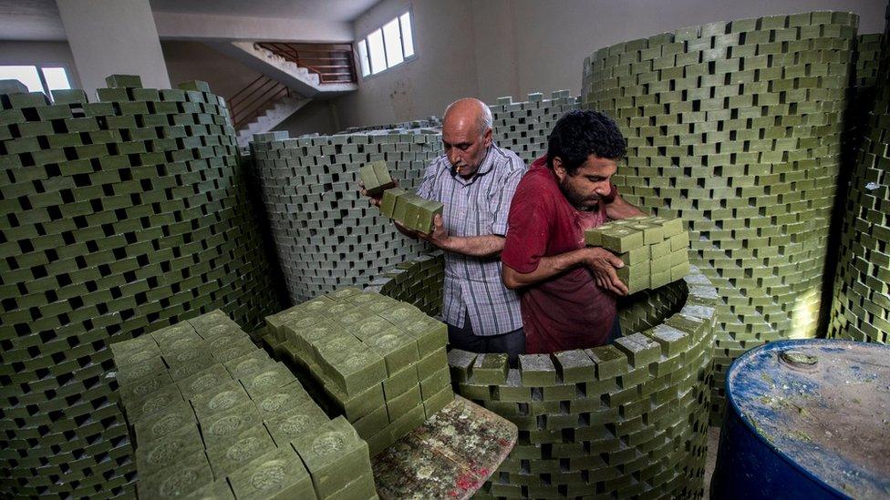 Workers stow soaps to dry at a workshop in Nizip, south-east Turkey