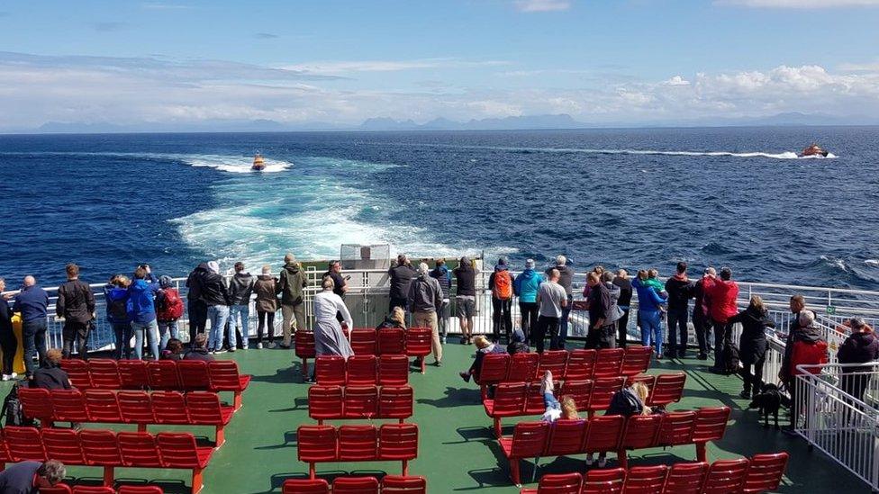 Passengers looking out towards the RNLI lifeboats