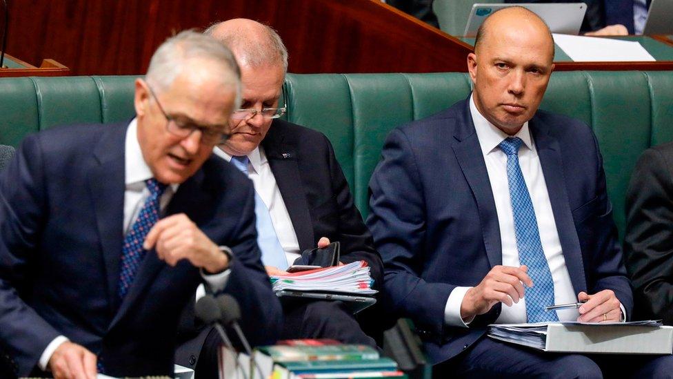 Peter Dutton looks at Malcolm Turnbull in parliament