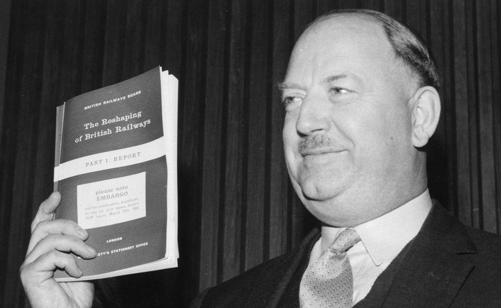 Richard Beeching holding a copy of his report in March 1963