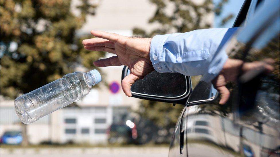 Litter being thrown from a car