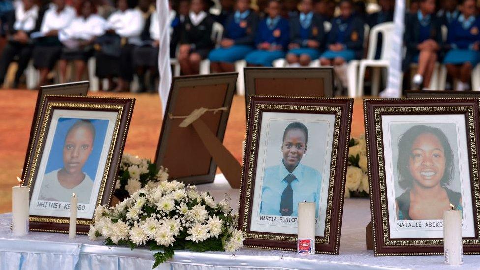 People attend the requiem mass for nine young girls who died in the Moi Girls School dormitory fire