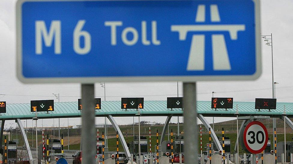 Vehicles approach the M6 motorway toll booths on March 13, 2005 in Birmingham, England.