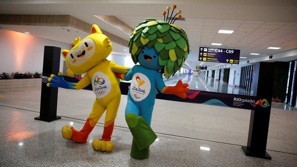 Olympic and Paralympic Games mascots Vinicius (L) and Tom pose during the opening ceremony of the new terminal at the international airport Galeao,