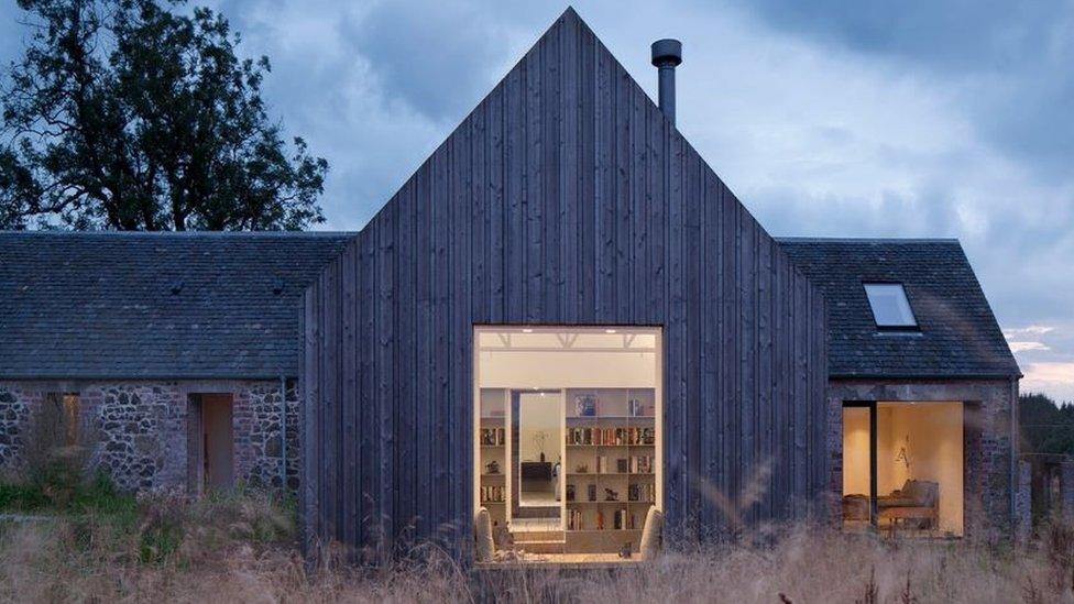 Cuddymoss is a timber covered cottage built around a ruined stone building.