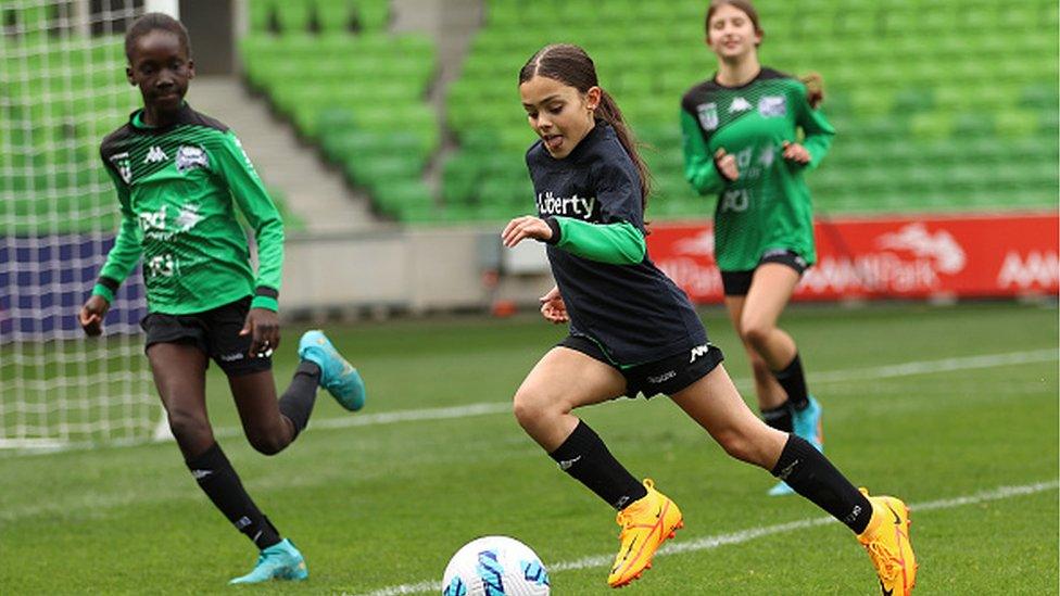 Girls playing football - generic