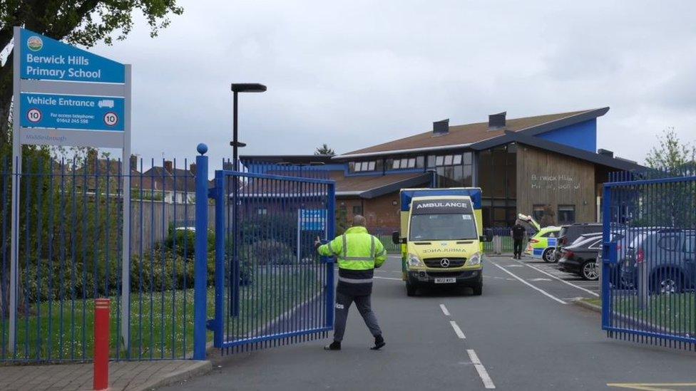 Ambulance leaving the school