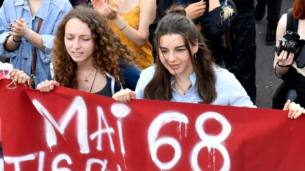 Students attend a protest rally along with railworkers of Sud Rail, post office workers, health workers at Tolbiac subway station near the blocked Tolbiac campus in April 2018