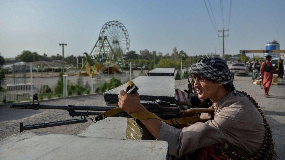 Afghan security forces and militia guard against Taliban attacks in Herat