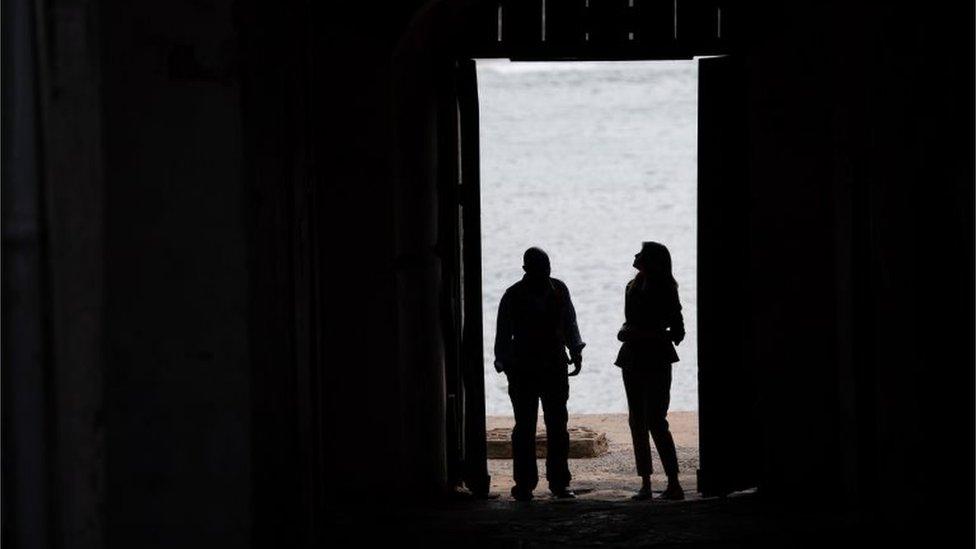 US First Lady Melania Trump stands with Kwesi Essel-Blankson, Museum Educator, at the Cape Coast Castle, a former slave trading fort, in Cape Coast, on October 3, 2018