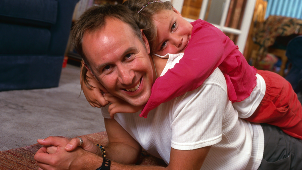 Steve James as a young father with daughter Rose