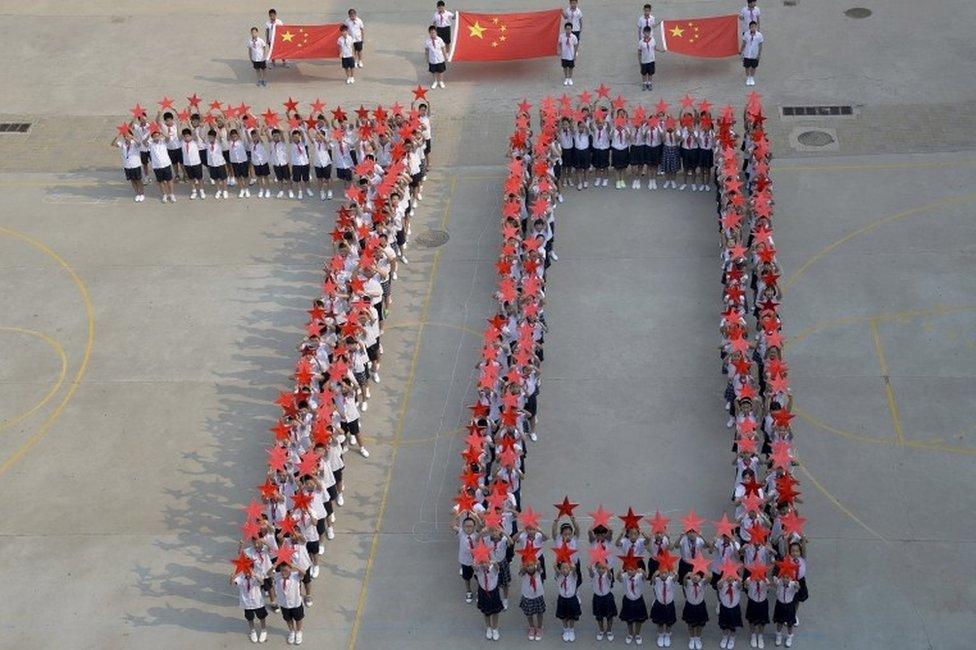 Students form the figure "70" as they pose with Chinese national flags and red stars during a event to mark the 70th anniversary of the Victory of Chinese People"s War of Resistance Against Japanese Aggression and the World Anti-Fascist War, at a primary school in Handan, Hebei province, China, August 31, 2015.