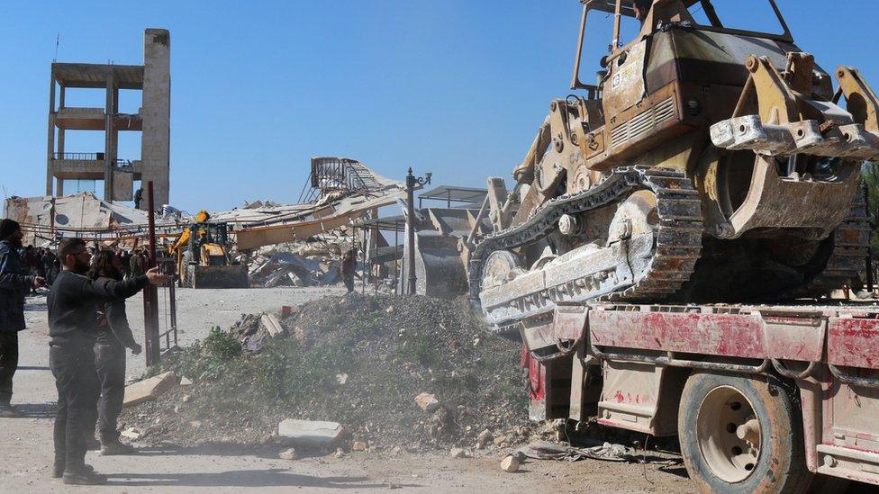 A bulldozer in the wreckage of an MSF hospital in Maarat al-Numan, Syria