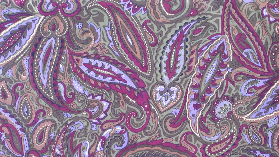 Purple paisley pattern on fabric