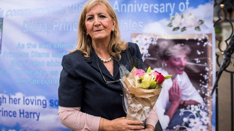 Angela Silva with a bunch of flowers