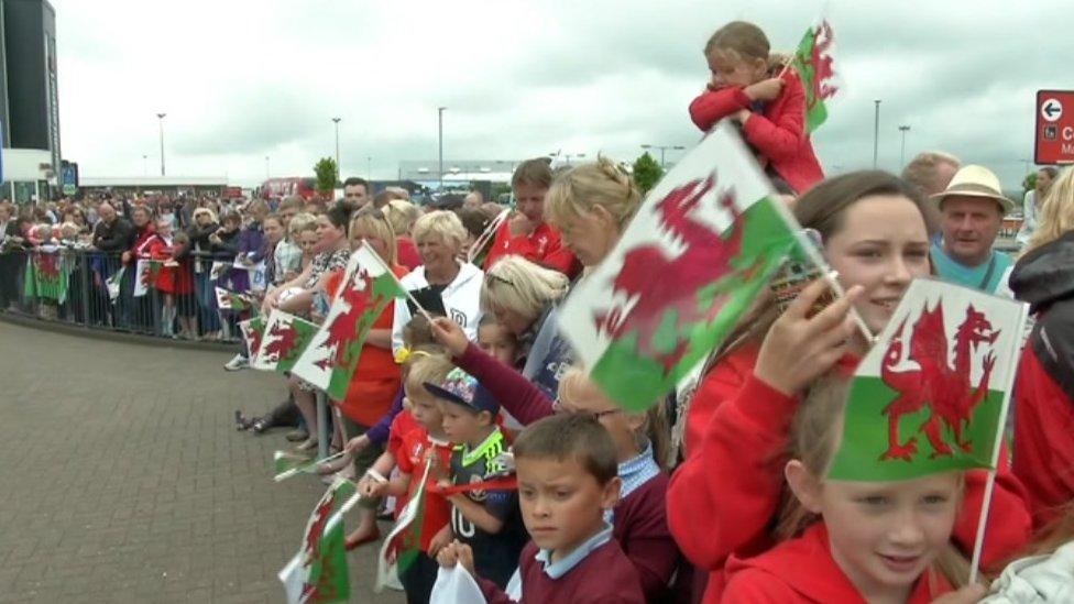 Crowds gather at Cardiff airport to welcome the Wales team home