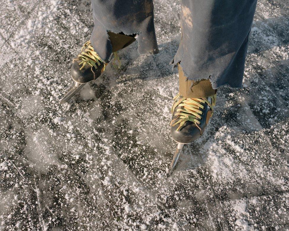 Peter wears his fishing kit over his clothes to keep warm on the ice