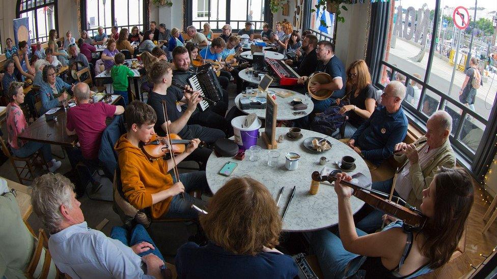 Musicians playing at a Manx festival