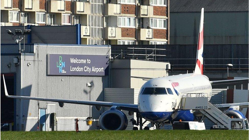 A plane waits on the tarmac at London City Airport