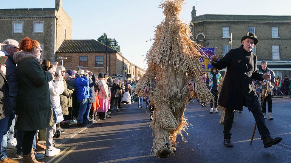 Straw bear and keeper, Whittlesey, 2024