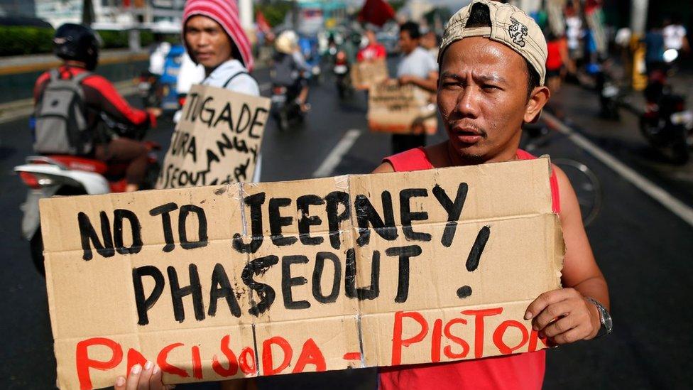 A Filipino driver at a protest to oppose government plans to phase out old and dilapidated jeepneys