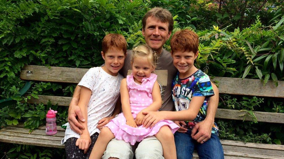 Terry Luxton with his three children