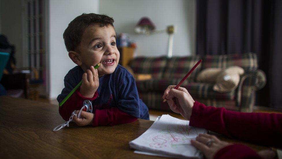 Syrian refugee Fadl Al Jasem colours on a piece of paper inside their temporary home in Picton, Ontario, Canada, Wednesday January 20, 2016.