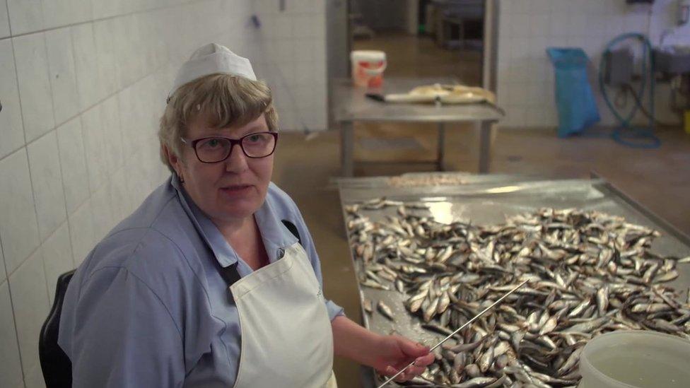 Ines, a fish processing worker in Freest on Germany's Baltic coast