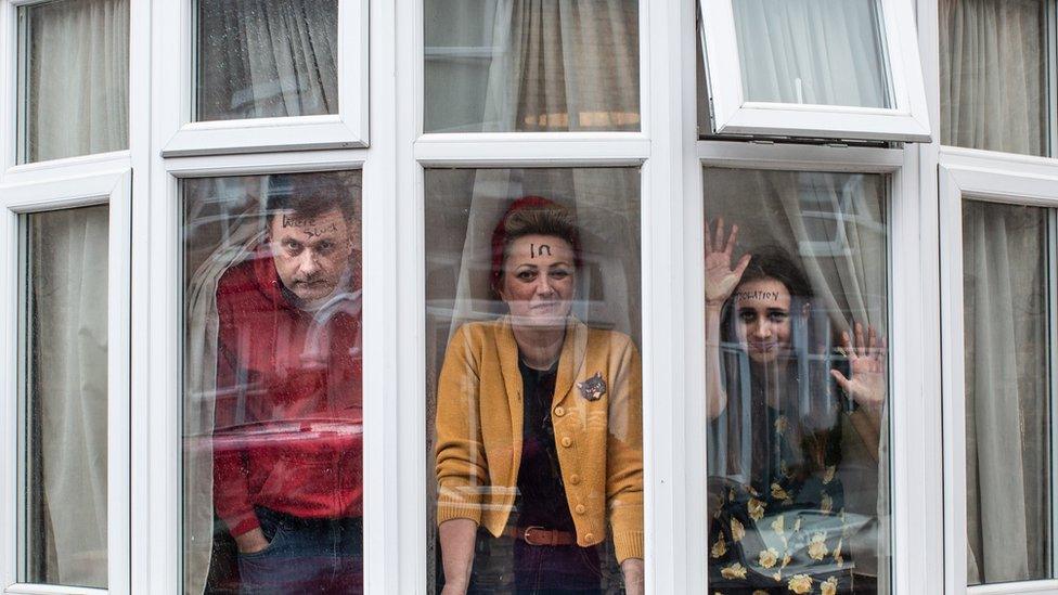 Family at a window