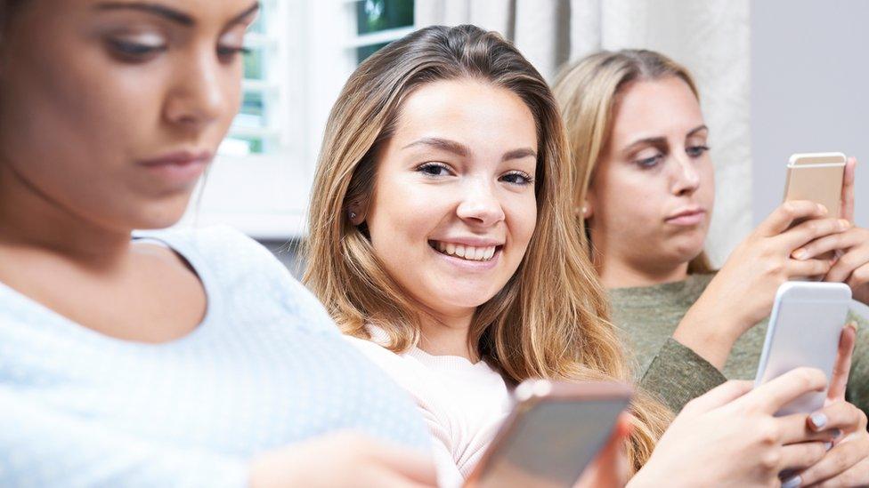 young women on phones