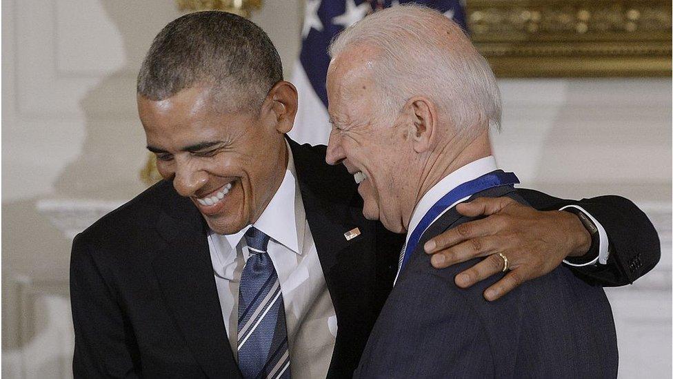 President Barack Obama (R) presents the Medal of Freedom to Vice-President Joe Biden during an event in the State Dinning room of the White House, January 12, 2017