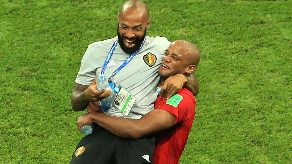 Thierry Henry celebrates Belgium's victory over Brazil with Vincent Kompany on 6 July