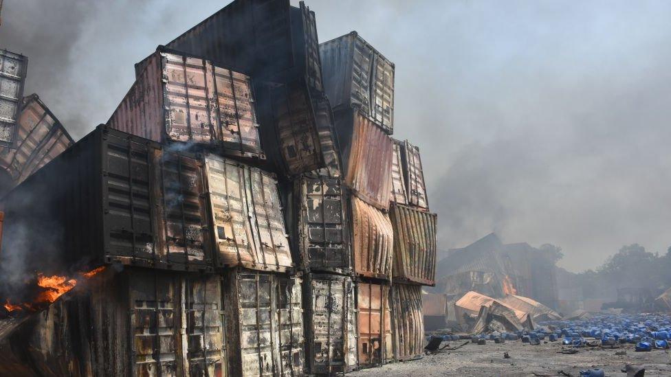 A pile of burned containers at the depot