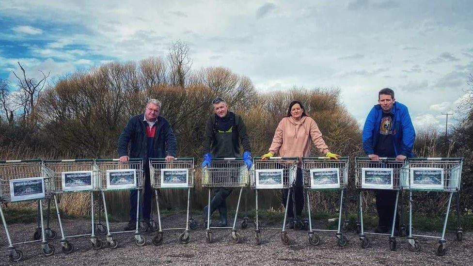 Campaigners pictured with shopping trolleys