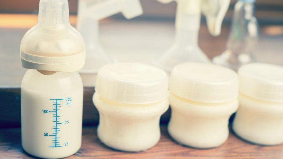 Baby milk in small bottle and small containers