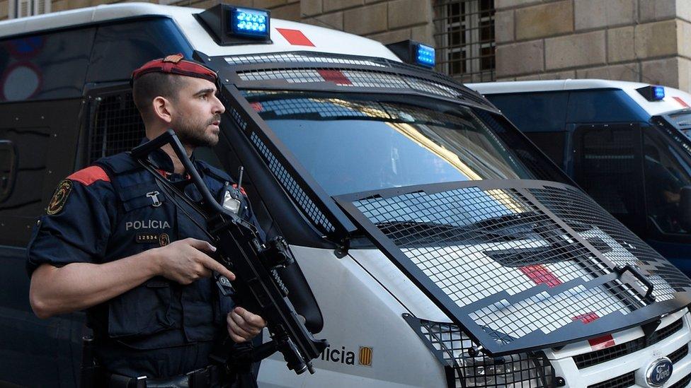 Catalonia's regional police force, known as Mossos, guard the Catalan government headquarters in Barcelona, 30 October 2017