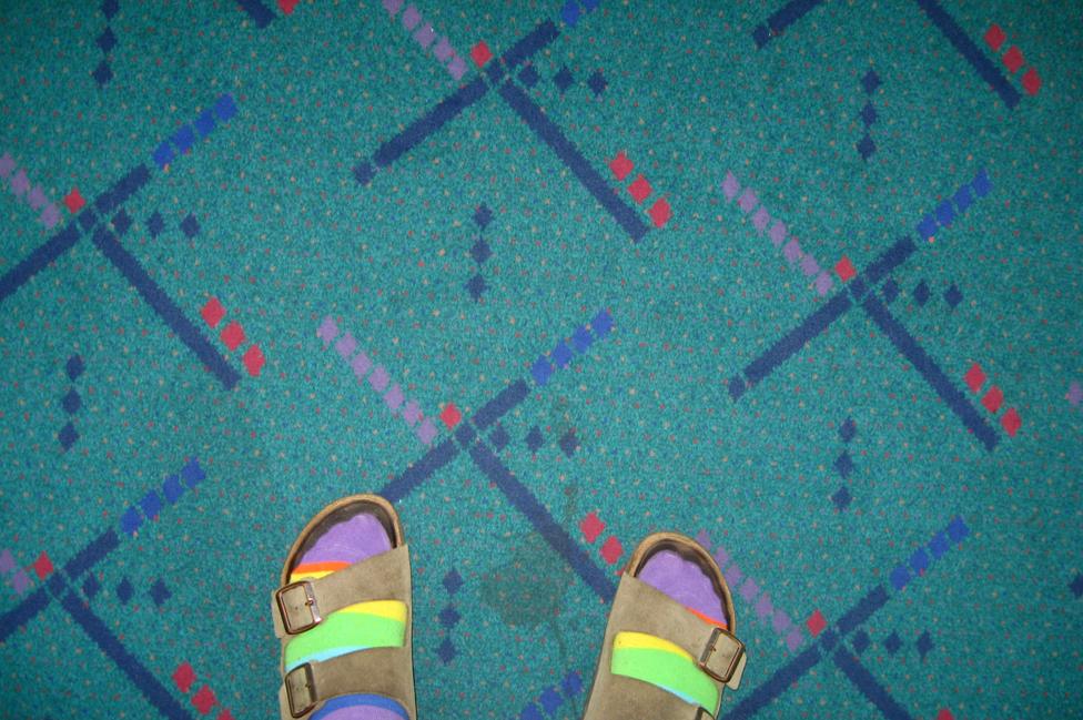 Feet on the Portland Airport carpet