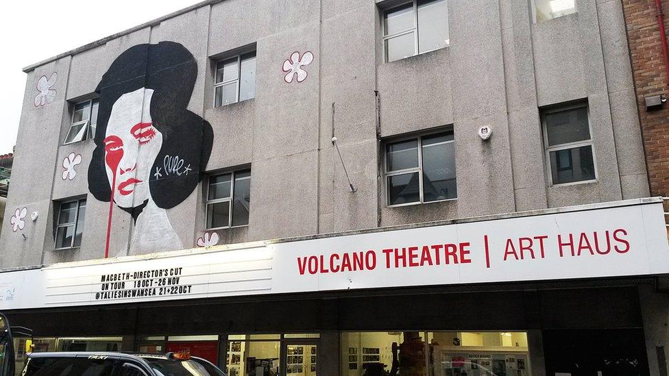 A mural by Welsh artist Charles Uzzell-Edwards, aka Pure Evil, on Swansea High Street's Volcano Theatre