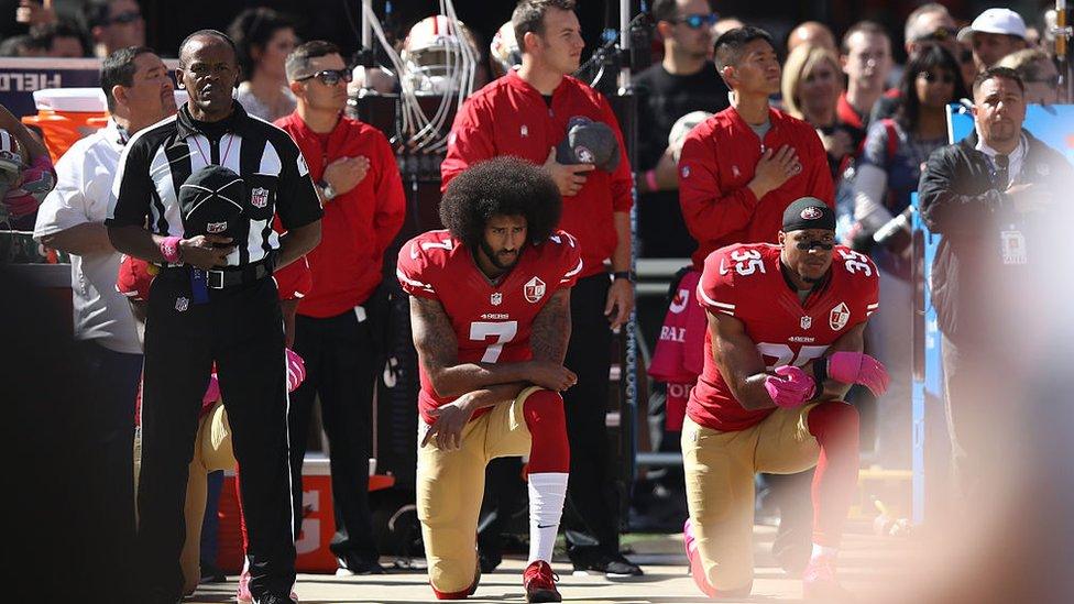 Eric Reid #35 and Colin Kaepernick #7 of the San Francisco 49ers kneel in protest during the national anthem prior to their NFL game against the Tampa Bay Buccaneers at Levi's Stadium on October 23, 2016