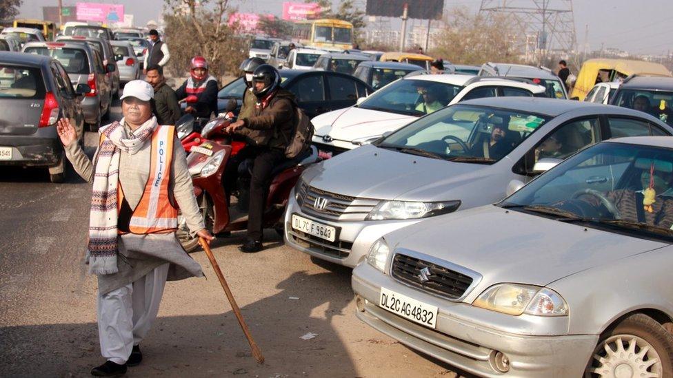 Ms Francis manages traffic at the intersection during peak morning and evening hours