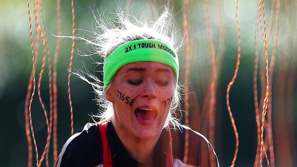 A participant tackles the Electroshock Therapy during the 2016 Tough Mudder