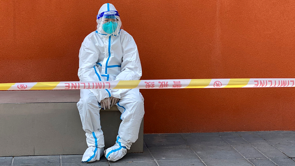 Shanghai worker in protective clothing