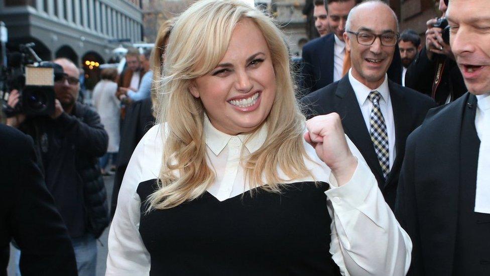 Rebel Wilson celebrates as she leaves court in Melbourne, Australia.