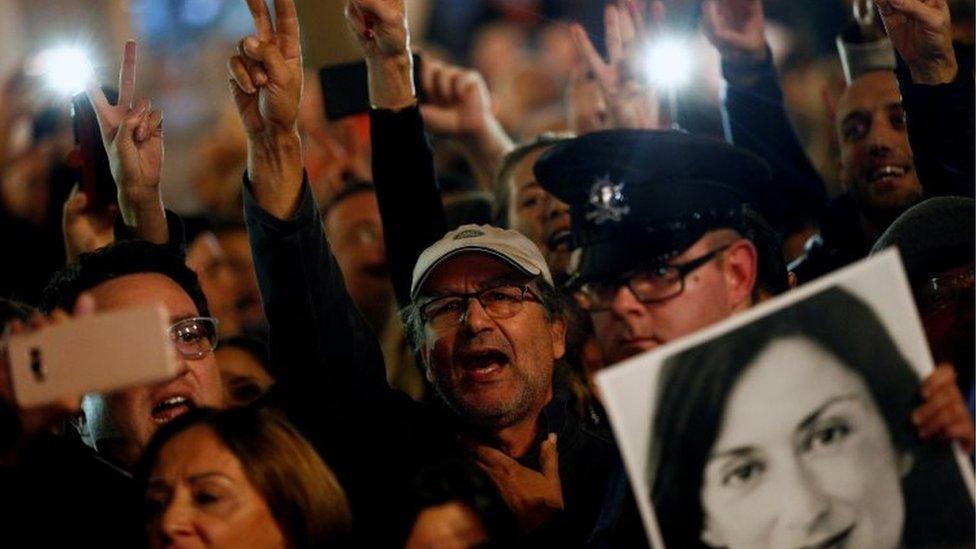 People demonstrate calling for the resignation of Joseph Muscat, following the arrest of one of the country"s most prominent businessmen,