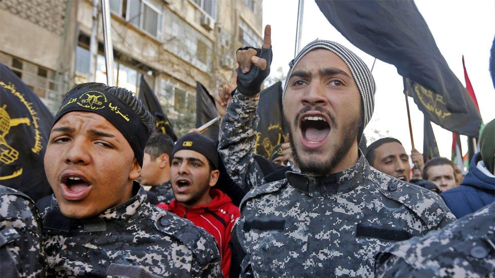 Palestinian Islamic Jihad supporters chant at the funeral of two militants killed in Israeli strikes near Damascus, Syria (24 February 2020)