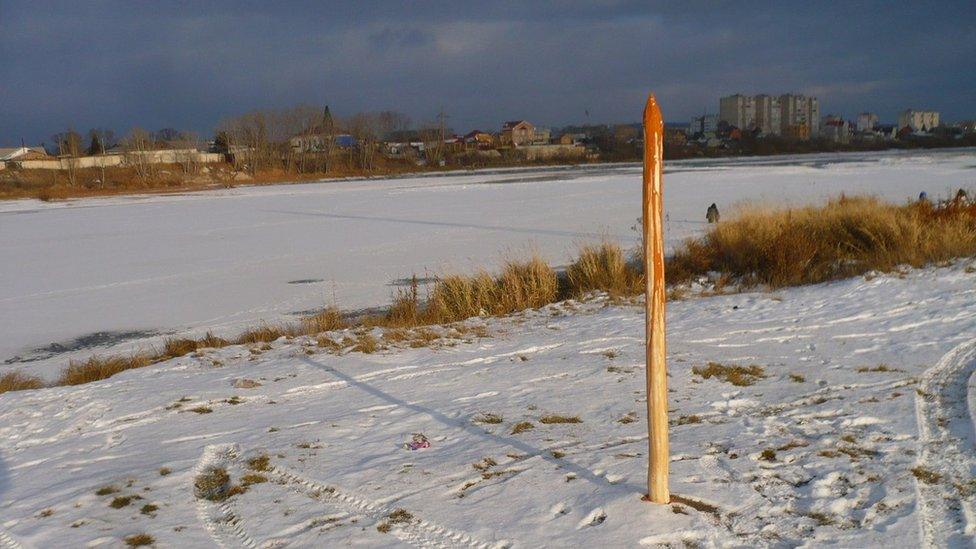 The stake with the river behind