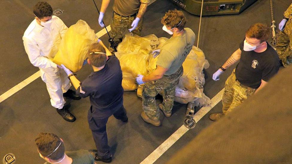 Crew of HMS Dragon with some of the hashish seized