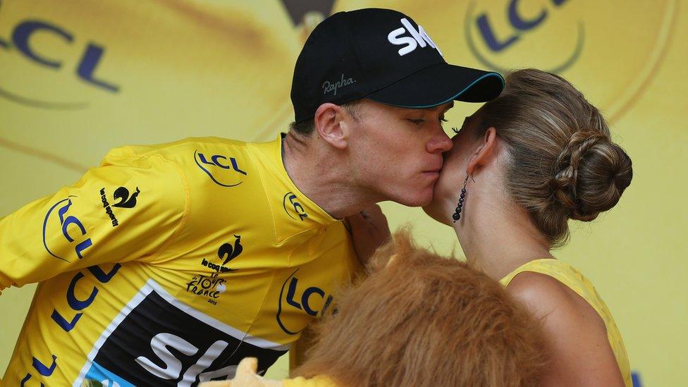 Chris Froome of Great Britain and Team Sky celebrates on the podium after Stage 18