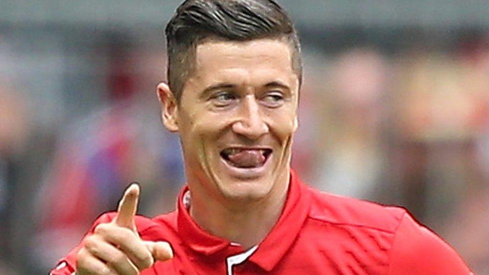 Robert Lewandowski celebrates scoring his 30th Bundesliga goal of the season